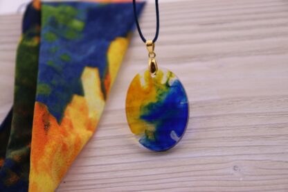 Epoxy Anhänger oval blau/ gelb